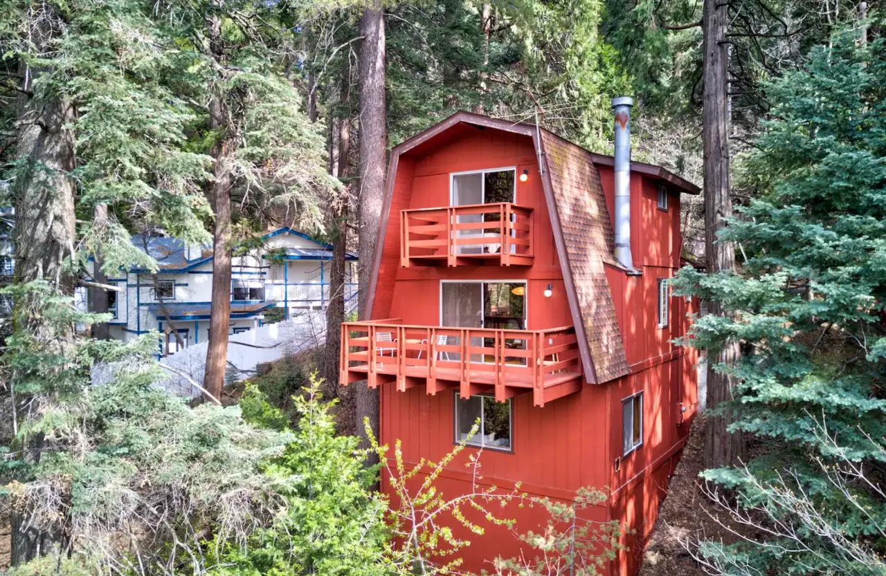 Red Skyforest Getaway A-frame cabin among pine trees